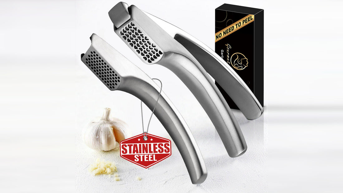 The Gourmet Easy garlic press with its two arms separated, beside its gift box
