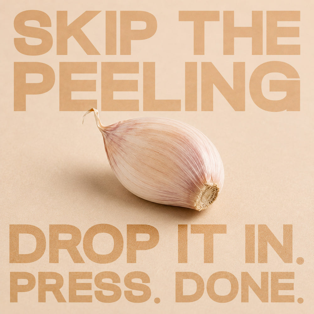 A single unpeeled garlic clove, ready to press skin on