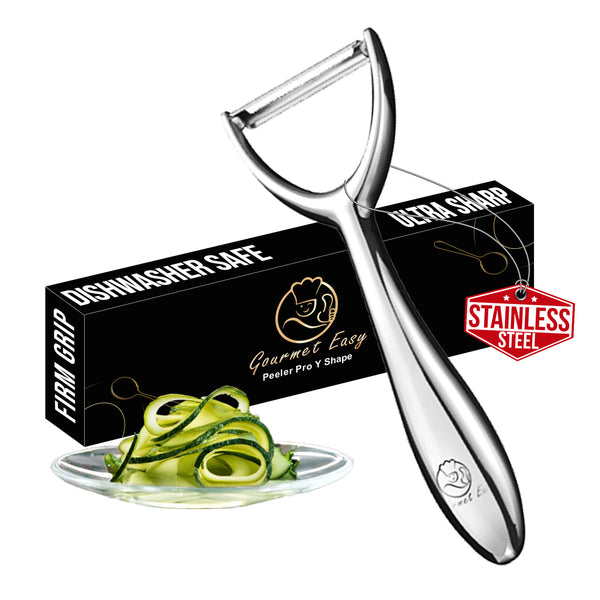 Gourmet Easy Y Peeler with its gift box and a plate of peeled courgette